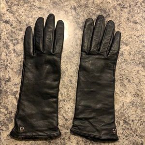 Ladies dark brown leather gloves by Aigner.